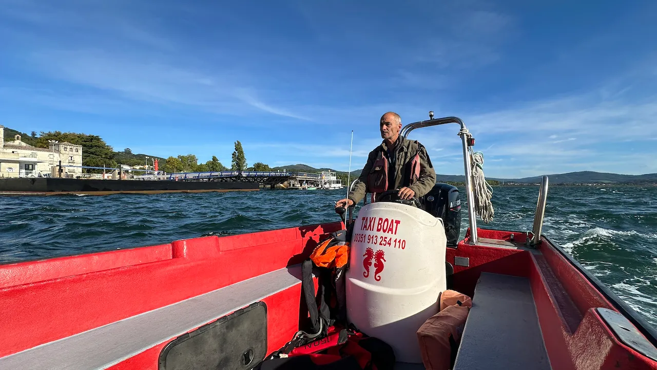 Miguel at the helm of a taxi boat on the Minho.